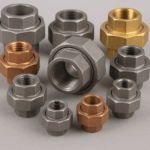 Assortment of union pipe fittings in different sizes and materials including steel, brass, and copper, displayed for industrial and plumbing applications.